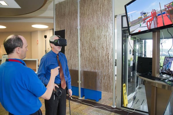 Image Above: Chapter President James (Jake) Mireles sharing design in VR with participant. Provided by the NASA-JSC Imagery Online Database, NASA Photographer: Bill Stafford.